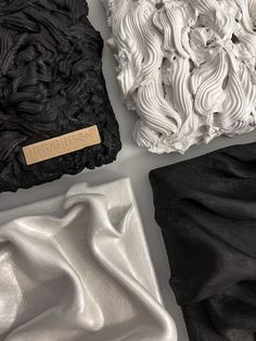 three different types of black and white fabric