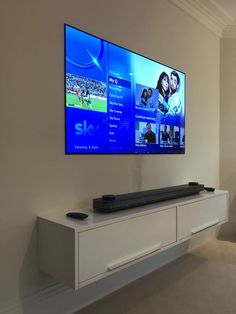 a flat screen tv mounted to the side of a wall