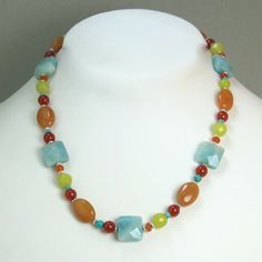 This Stunnning Necklace Is Made With Genuine Aqua, Chartreuse, And Yellow Jade As Well As Turquoise Carnelian Beads. They Are Complemented With Textured Sterling Silver Plated Spacer Beads And Sterling Silver Findings. The Clasp And Extender Chain Are 925 Sterling Silver Adjustable From 16 1/2 To 17 1/2 Inches Each Piece Comes In A Gift Box With Bow Ready For Giving. As With All Handmade Items Using Natural Materials, There Are Slight Variations In Each Stone. Orange Gemstone Bohemian Beaded Necklace, Bohemian Orange Beaded Necklaces With Gemstones, Bohemian Orange Gemstone Necklaces, Bohemian Orange Beaded Necklace With Gemstones, Orange Bohemian Beaded Necklace With Gemstones, Bohemian Orange Gemstone Necklace, Orange Bohemian Gemstone Necklace, Multicolor Carnelian Bohemian Necklaces, Bohemian Multicolor Carnelian Necklaces