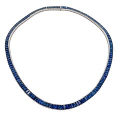 18kt Sapphire Tennis Necklace: 28cts of unheated emerald-cut sapphires Channel-set design GIA certified Luxury Baguette Cut Emerald Necklace For Formal Occasions, Luxury Baguette-cut Emerald Necklace For Formal Occasions, Formal Emerald Baguette Cut Necklace, Formal Sapphire Jewelry With Baguette Diamonds, Formal Sapphire Necklace With Rectangular Shape, Sapphire Baguette Cut Necklace For Formal Occasions, Formal Sapphire Baguette Cut Necklace, Channel Set, Tennis Necklace