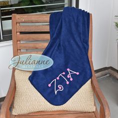 a blue towel sitting on top of a wooden chair