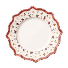 a white plate with red trim and flowers on the rim, against a white background