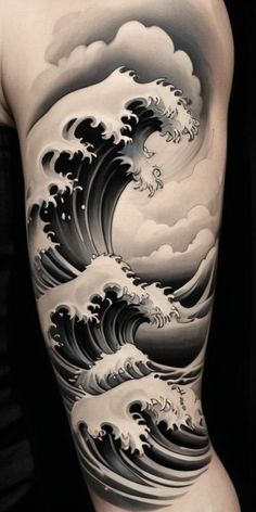 the back of a man's body with an ocean wave tattoo on it,