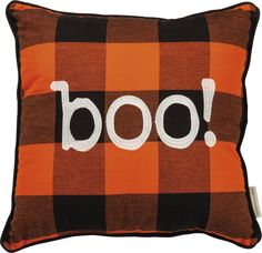 an orange and black plaid pillow with the word boo on it's front side