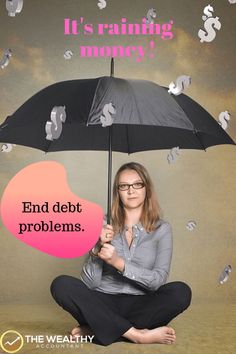 a woman sitting on the floor holding an umbrella with money falling from it and words above her