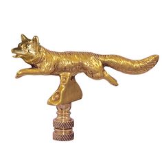 a golden fox statue on top of a wooden pole