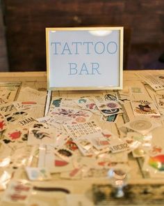 a table topped with lots of different types of tattoos