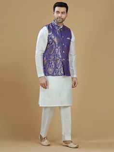 A gold zari brocade vest to pair with any kurta with statement button closures at the front. Occasion: Style this vest with pajama pants and a kurta for a welcome dinner or sangeet night, or style it with a any dress shirt and trousers for a sleek Indian wedding reception look! WASH CARE INSTRUCTIONS - Please Dry clean only. Slight color variation is possible due to digital photography. **Kurta & Pajama not included Sleeveless Bandhgala For Eid, Traditional Sleeveless Bandhgala With Zari Work, Sleeveless Bandhgala For Festivals, Sleeveless Nehru Jacket For Diwali, Brocade Nehru Jacket For Diwali Designer Wear, Diwali Brocade Nehru Jacket For Designer Wear, Diwali Designer Brocade Nehru Jacket, Sleeveless Traditional Sets For Formal Occasions, Traditional Sleeveless Nehru Jacket For Festive Occasions