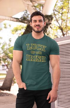 Men's Luck Of The Irish Shirt St. Patrick's Day TShirts Typography Tee Irish Gift Minimal Cool St Pattys Shirt Men Women Unisex Tee Gift Idea Show off your Irish pride in this tee for St. Patrick's day with a minimal logo that features a bold typography. It simply reads 'Luck Of The Irish' in a gold color. Show of your luck in a shirt printed just for you. A great shirt to wear throughout the year, but especially on St. Patrick's day! We only print on soft ring spun cotton. Includes our signatur Father's Day Fan Apparel Short Sleeve Tops, Fan Apparel Short Sleeve Tops For Father's Day, Green T-shirt With Letter Print For Father's Day, Green Father's Day T-shirt With Letter Print, Green Letter Print T-shirt For Father's Day, St. Patrick's Day Graphic Print Crew Neck Top, St. Patrick's Day Cotton Crew Neck Tops, Funny Green Crew Neck Shirt, Cotton Crew Neck Top For St. Patrick's Day