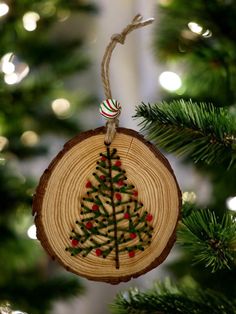 a wooden ornament hanging from a christmas tree