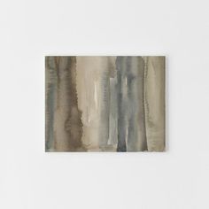 an abstract watercolor painting with grey and brown tones on white paper next to a wall