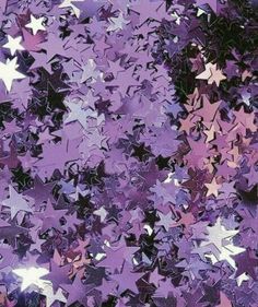 purple and white stars are scattered on the ground