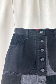 A-Line Patchwork denim skirt. Made from reclaimed denim, and repurposing waistbands and belt loops from old jeans. Based on the 90's style these are available in Blue and Black colourways. Each skirt is unique, made to order with a slightly different palette for each, some even featuring cute visible mending details. 100% Cotton. With a Red ReJean label on the back, 2 rounded front patch pockets, 1 repurposed back patch pocket, button-front closure with brass or gunmetal black stud buttons. Black Denim Mini Skirt, Patchwork Denim Skirt, A Line Denim Skirt