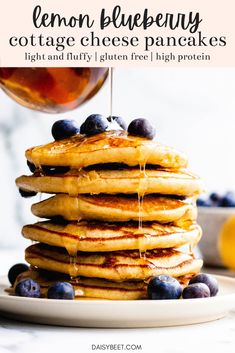 stack of lemon blueberry cottage cheese pancakes with syrup drizzled on top