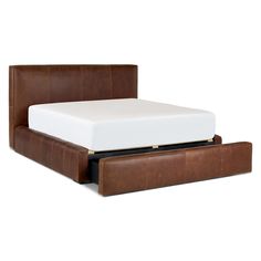 a bed with a brown leather frame and mattress