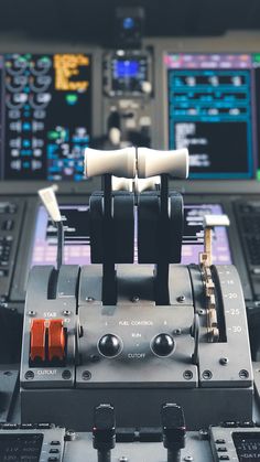 the control panel of an airplane with two different controls on each side and one in front