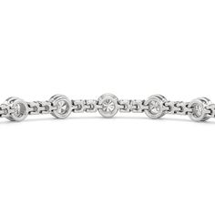 A testament to our vision of harmonizing luxury and simplicity. This tennis bracelet features a continuous line of round diamonds laid out in a pattern of one alternating bezel-set round diamond and a duo of claw prong-set round diamonds. The bracelet's understated design showcases the unparalleled fire and brilliance of the most popular diamond shape. Diamond White Tennis Bracelet With Bezel Setting, Timeless Round Channel Set Bracelets, Timeless Round Diamond Bracelet Channel Set, Timeless Round Diamond Bracelet With Channel Set, Timeless Diamond Bracelet With Bezel Setting, Modern White Gold Diamond Bracelet Channel Set, White Gold Channel Set Diamond Bracelet, Timeless Round Channel Set Bracelet, Timeless Round Channel Set Diamond Bracelet