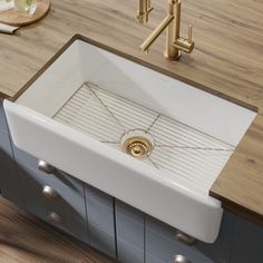 a white sink sitting on top of a wooden counter