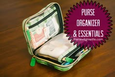 an open green case sitting on top of a wooden table with the words purse organizer and essentials