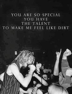 a group of people standing around each other in front of a sign that says, you are so special you have the talent to make me feel like dirt