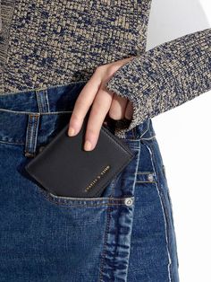 Timeless and practical, this minimalistic black wallet is perfect if you are looking for a no-fuss option. When open, the wallet offers a spacious inner compartment, while its compact design makes it easy to fit into bags of all sizes and back pockets too. Use the zip-around design to keep your belongings safe and secure. Black Daisy, Ladies Wallet, Black Iphone, Short Wallet, Black Wallet, Minimalist Wallet, Charles Keith, Sand Color, Small Wallet