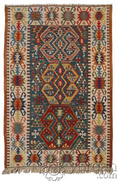 an old rug with many different colors and patterns