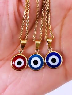 🌸Our Evil Eye Jewelry is made with 3%(1/30) gold content using 18Kt. The base metal for this type of jewelry is brass. Gold Filled is a great quality alternative to solid gold. Items labeled gold filled with proper care and storage have a durability life of over 1 Year. This evil eye necklace protects you away from Evil and bad things. A beautiful round rainbow blue eye pendant is suitable for many occasions! Beautiful as a gift. 🌸 All pieces available are delicate. Simple and elegant. A perfe Traditional Gold Evil Eye Necklace, Gold Round Chain Necklace Gift, Gold Round Chain Necklace As Gift, Gold Symbolic Evil Eye Charm Necklaces, Gold Symbolic Charm Necklaces With Evil Eye, Symbolic Gold Evil Eye Charm Necklaces, Gold Evil Eye Necklace As Gift, Gold Evil Eye Symbolic Necklace, Gold Spiritual Metal Necklace