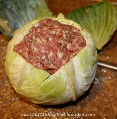 a head of cabbage with meat in the center