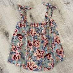 Nwt American Eagle Can Be Worn As A Tie Top Or Off Shoulder Pink And Mint Blue Floral Size Small No Trades *** I Will Not Negotiate In Comments Section. If You Make An Offer In The Comments Section I Will Ignore It. If You Would Like To Negotiate A Price Please Do So Under The Offer Button. Thanks For Understanding*** Feminine Blue Tops For Vacation, Cute Light Blue Tops For Vacation, Cute Light Blue Top For Vacation, Cute Floral Print Tank Top For Day Out, Casual Pink Tops For Brunch, Cute Floral Print Tops For Vacation, Sleeveless Light Blue Tops For Brunch, Light Blue Sleeveless Top For Brunch, Casual Pink Tank Top With Floral Print