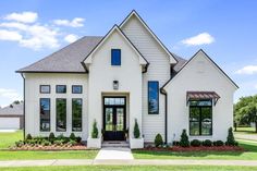 a white house with black trim and windows