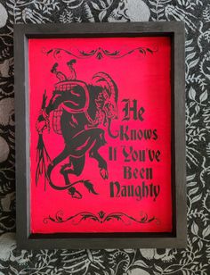 a red and black framed sign with the words he knows if you've been dancing