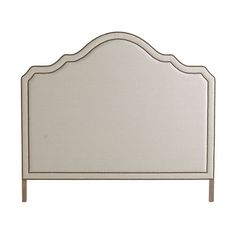 an upholstered headboard with beading on the top and bottom part of it