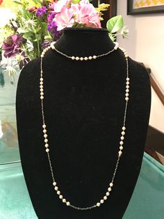 "This piece was designed to copy an actual necklace worn by Lady Mary in the PBS series Downton Abbey. This necklace is 50\" of glittering faceted gold natural iron pyrite beads interspersed with mint condition 6mm vintage cream faux Majorca pearls OR genuine AAA freshwater pearls (choose when you checkout). This is a VERY long necklace; it measures 50\" total from top to bottom. It can be worn as one long necklace (if you're tall or channeling your inner flapper) but it's also meant to be loope Downton Abbey Jewelry, Delicate Single Strand Necklaces For Formal Occasions, Delicate Single Strand Necklace For Formal Occasions, Delicate Long Necklace For Formal Occasions, Elegant Hallmarked White Gold Chain Necklace, Delicate Chain Necklace For Formal Occasions, Elegant Evening Lariat Chain Necklace, Elegant Lariat Chain Necklace For Evening, Elegant Sterling Silver Hallmarked Chain Necklace