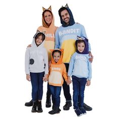 two adults and two children wearing animal onesuits on their heads, standing next to each other