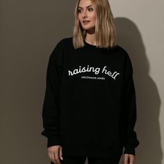 Show off your wild side with our Raising Hell Sweatshirt. Coming in black, this crewneck sweatshirt is just what you need to make sure everyone knows you’re a little bit of a wild card. For a full look, pair your sweatshirt with our Raising Hell Trucker Hat. Want more Uncommon James sweatshirts? Shop our full apparel line.