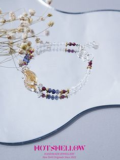 Inspired by the ancient Greek myth of the Lethe River, the "Wangchuan" bracelet captures the essence of forgetfulness and renewal. Just as the river's waters were believed to wash away the memories of the past, this bracelet, adorned with faceted white crystal beads, symbolizes a fresh start and clarity of mind. Each bead is meticulously faceted to enhance its natural brilliance, complemented by delicate accents that add a touch of elegance. This piece is a harmonious blend of mythology and mode Silver Healing Bracelet With 108 Beads, Spiritual Faceted Crystal Bangle Bracelet, Silver Bracelet With 108 Beads For Healing, Spiritual Silver Beaded Bracelets For Blessing, White Spiritual Beaded Bracelets For Blessing, White Spiritual Beaded Bracelet For Blessing, Spiritual White Beaded Bracelets For Blessing, Spiritual Bracelet With Faceted Beads, Lethe River