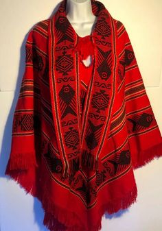 Vintage Otavalito hand knit Ecuador poncho. Red black and white ethnic pattern. Fringe on the bottom and on the tie at neck. Attached scarf. Great condition! 43" front top to bottom 28" side seams46" across front Orange Poncho, Native Fashion, Hand Knit Poncho, Boho Poncho, Native American Patterns, Mode Hippie, Red Boho, Native Style, Clothing Designs