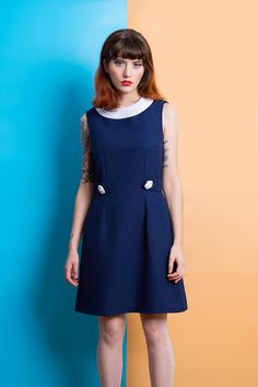 Navy blue mod Peter pan collar dress flower  bishop mod 1960s dress Fitted Navy Dress With Buttons, Mod A-line Vintage Dress, Navy Vintage Dresses With Buttons, Retro Navy Dress For Spring, Navy Vintage Dress With Buttons, Blue A-line Mod Dress, Navy Retro Dress For Work, Mod Sleeveless Dresses With Buttons, Navy Retro Workwear Dress