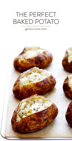 baked potatoes on a baking sheet with cheese