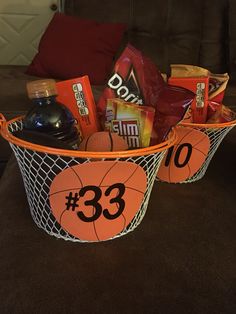 a basket filled with sports items on top of a couch