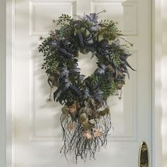 a wreath is hanging on the front door