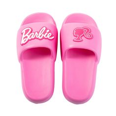 a pair of pink slippers with barbie's logo on the front and back