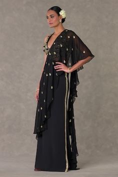 Black saree gown with attached ruffle pallu and pitta, dori, kaam in paan phool motifs and waist cut-out detailing. - Aza Fashions Traditional Drape Dress With Sheer Dupatta For Gala, Chic Dresses With Traditional Drape For Festive Occasions, Formal Dress With Sheer Dupatta And Cape Sleeves, Elegant Georgette Pre-draped Maxi Saree, Elegant Pre-draped Maxi Length Georgette Saree, Evening Gown With Sheer Dupatta, Festive Pre-draped Evening Gown, Black Cape Sleeve Festive Dresses, Elegant Georgette Maxi Dress With Traditional Drape