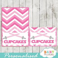 two pink and white cupcakes labels with the word cupcakes printed on them