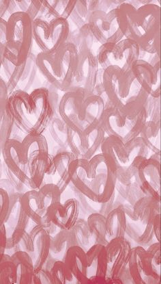 an abstract background with many hearts drawn in red and pink ink on the bottom right corner