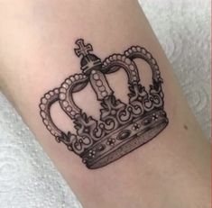 a tattoo with a crown on it