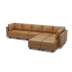 a brown leather sectional sofa sitting on top of a white floor next to an ottoman