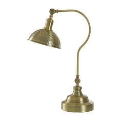 an antique brass desk lamp with a metal shade on the top and bottom, against a white background