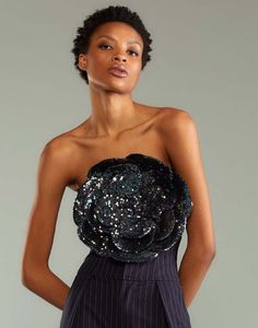 Dark blue and black all over sequin flower bandeau top.    - oversized 3d appliqué sequin flower  - strapless bandeau style top  - fabric content: 100% polyester  - care instructions: dry clean only    fit: model is 5'10" and wears a size s.    complete the look: pinstripe corset pant Pinstripe Corset, Corset Pants, Sequin Flower, Strapless Bandeau, Cynthia Rowley, Top Fabric, Bandeau Top, Cocktail Hour, Blue And Black