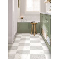 a white and green bathroom with checkered flooring on the walls, counter tops and cabinets